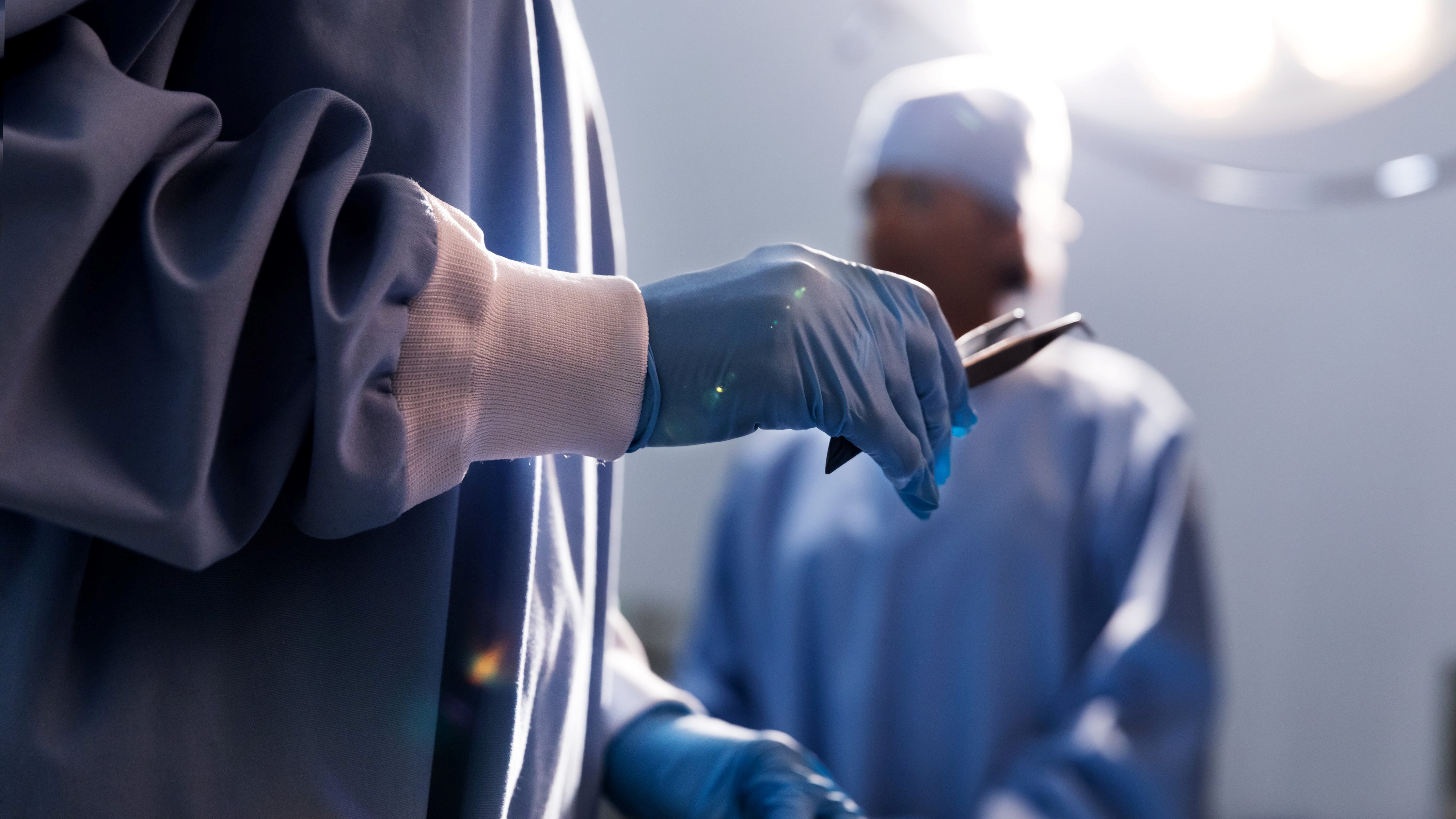 Doctor Holding Tweezers